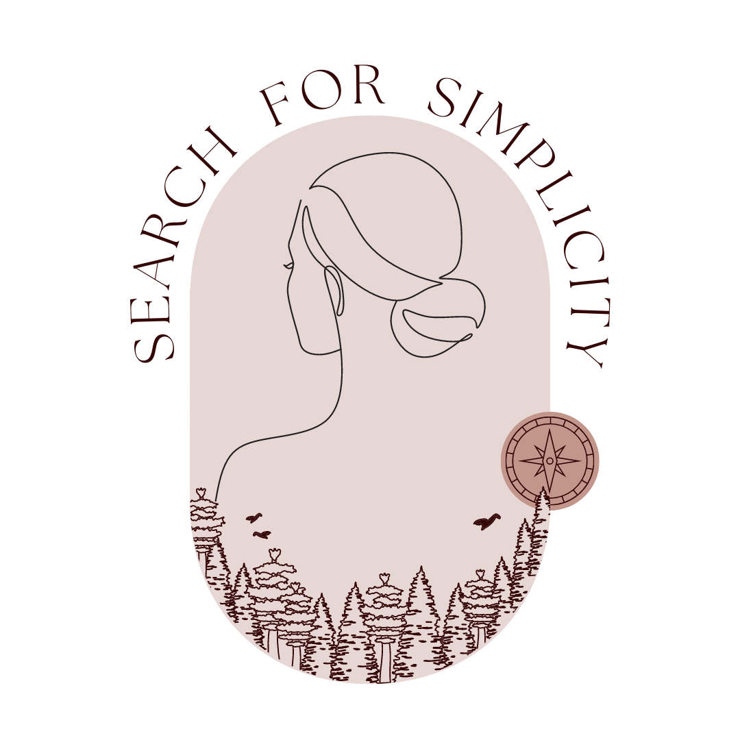 The Search for Simplicity Logo. It is a blush pink oval background with an outline of a woman looking away from the viewer, a curved outline of a forest and an outline of a compas 